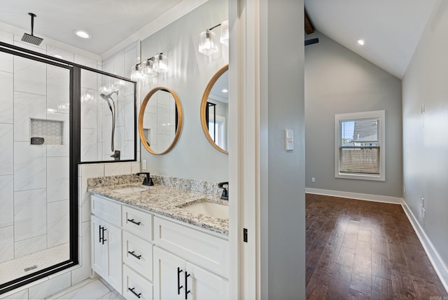 bathroom with hardwood / wood-style floors, vanity, an enclosed shower, and lofted ceiling