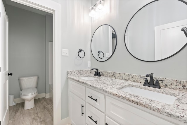 full bathroom featuring vanity, toilet, and shower / bathtub combination