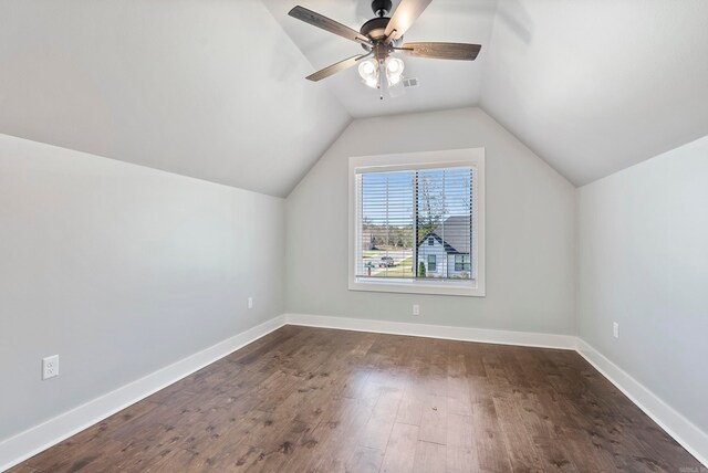 bonus room with dark wood-type flooring, ceiling fan, and lofted ceiling