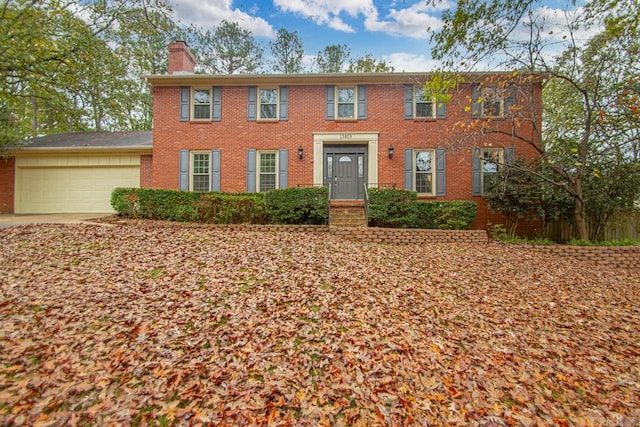 colonial inspired home with a garage