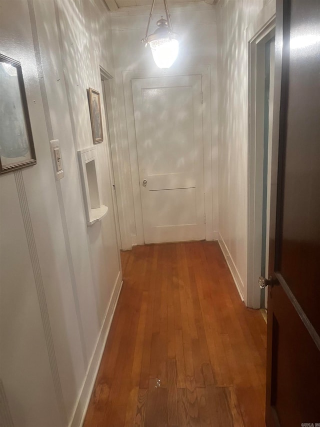 hallway featuring hardwood / wood-style flooring