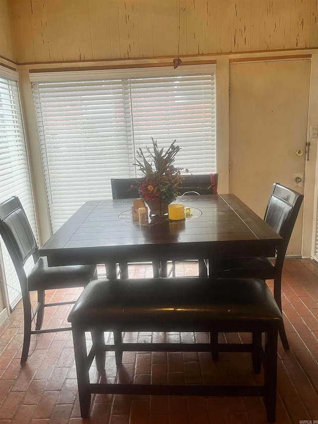 dining area with wood walls