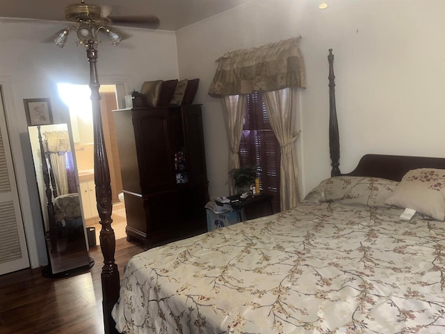 bedroom featuring ceiling fan, crown molding, and wood-type flooring