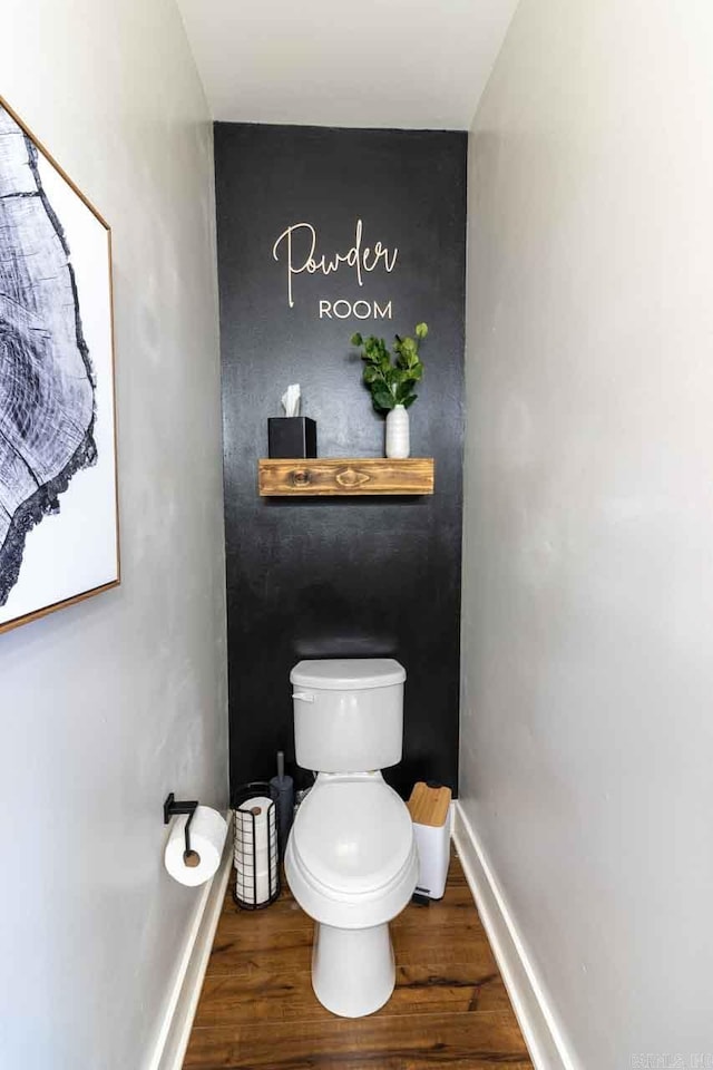 bathroom featuring toilet and hardwood / wood-style flooring