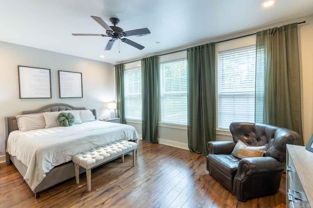 bedroom featuring ceiling fan and dark wood-type flooring