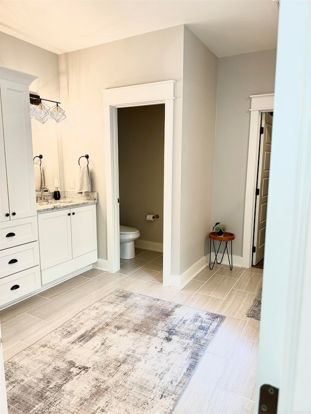 bathroom with vanity and toilet