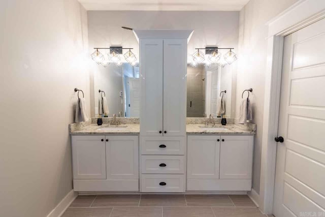 bathroom with vanity and tile patterned floors