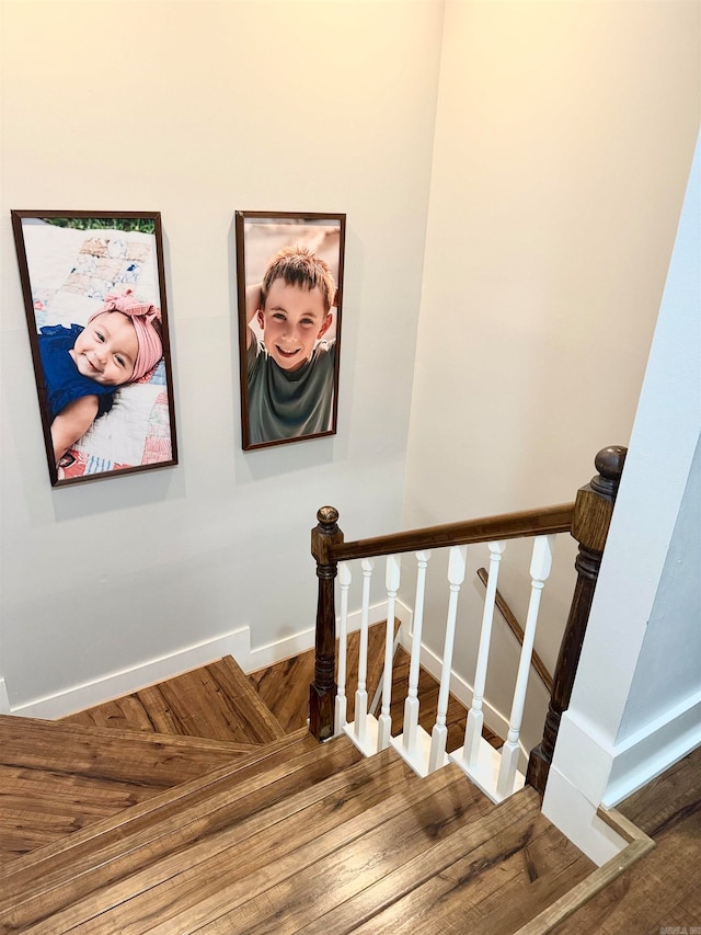 stairway featuring hardwood / wood-style flooring