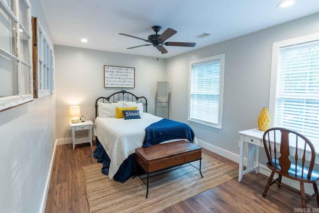 bedroom featuring ceiling fan and dark hardwood / wood-style flooring