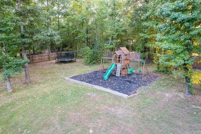 view of play area with a lawn and a trampoline