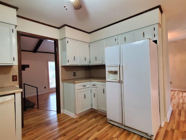 kitchen with white appliances, light hardwood / wood-style floors, and white cabinetry