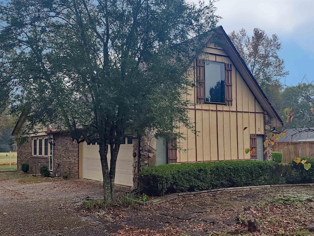 view of property exterior featuring a garage