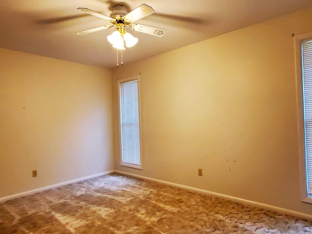 empty room featuring carpet flooring and ceiling fan