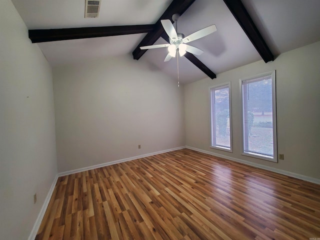 spare room with vaulted ceiling with beams, ceiling fan, and hardwood / wood-style flooring