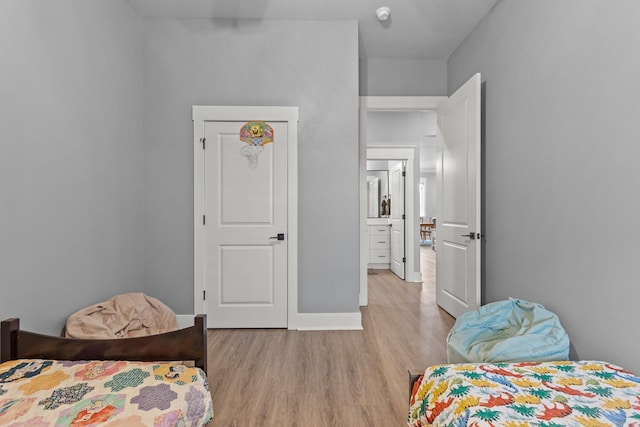 bedroom with light hardwood / wood-style floors