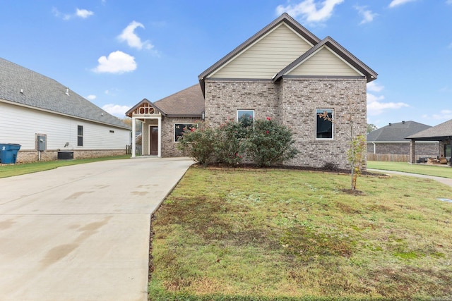 view of front of house featuring a front yard and central air condition unit