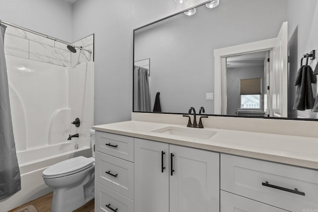 full bathroom featuring hardwood / wood-style floors, vanity, toilet, and shower / bath combo with shower curtain