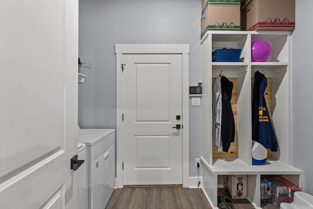 mudroom featuring independent washer and dryer and light wood-type flooring