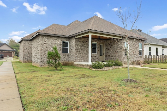 view of side of home featuring a yard