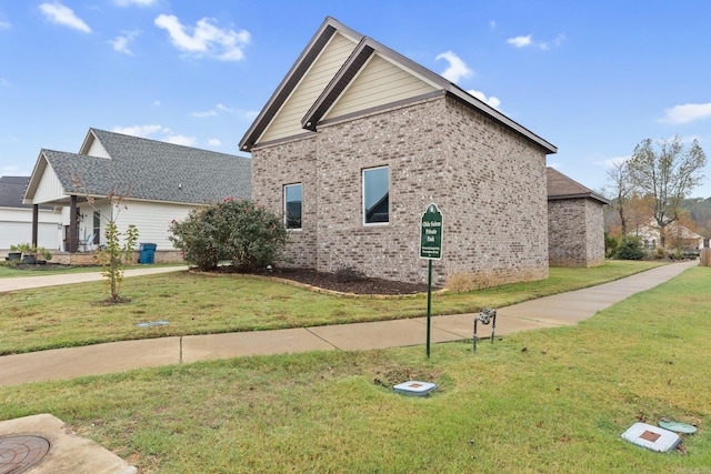 view of property exterior featuring a lawn