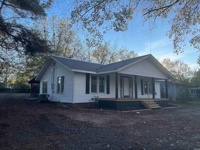 view of front of house with central air condition unit and a porch