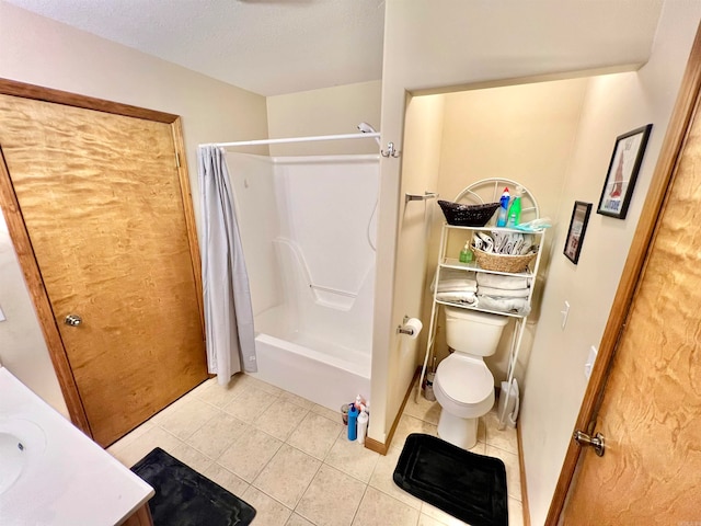 full bathroom with vanity, toilet, shower / bath combo with shower curtain, and tile patterned flooring