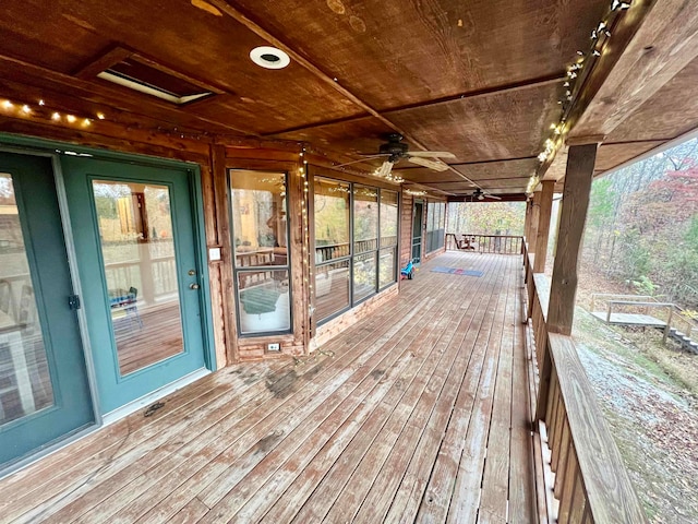 wooden terrace featuring ceiling fan