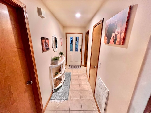 corridor featuring light tile patterned floors