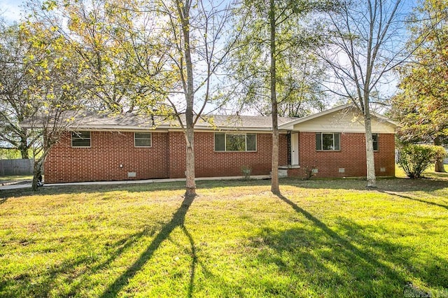 rear view of property with a yard