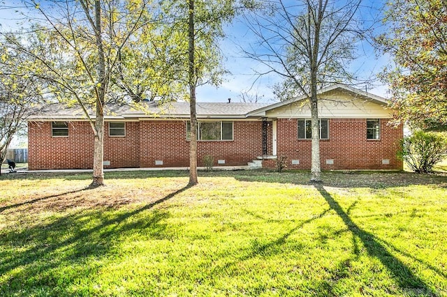 back of house with a lawn