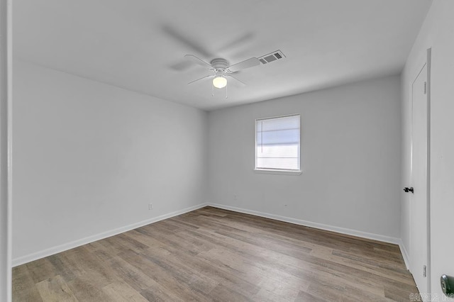 spare room with light hardwood / wood-style floors and ceiling fan