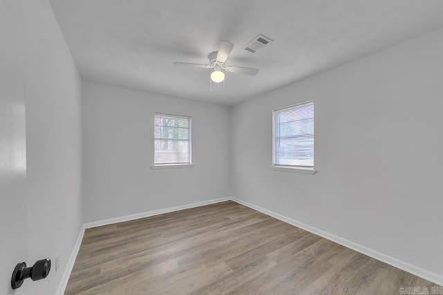 spare room with ceiling fan and light hardwood / wood-style flooring