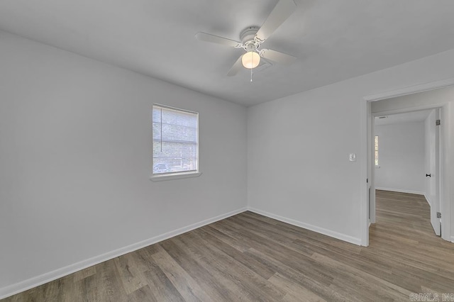 spare room with ceiling fan and light hardwood / wood-style floors