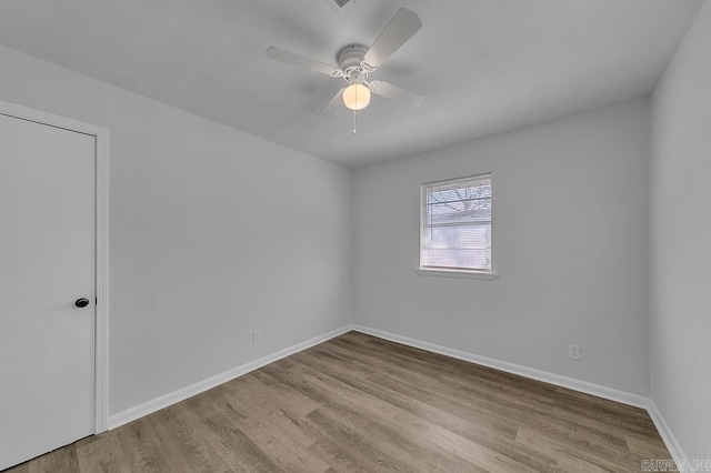 empty room featuring light hardwood / wood-style flooring and ceiling fan