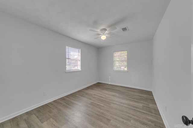 spare room featuring ceiling fan and light wood-type flooring