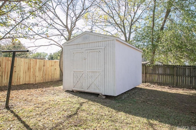 view of outdoor structure featuring a lawn