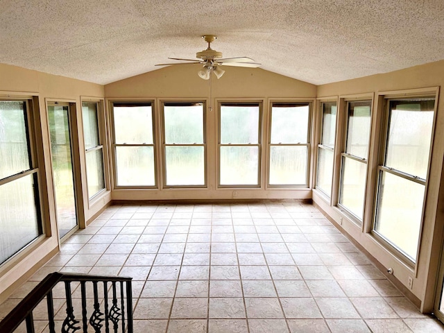 unfurnished sunroom with vaulted ceiling and ceiling fan