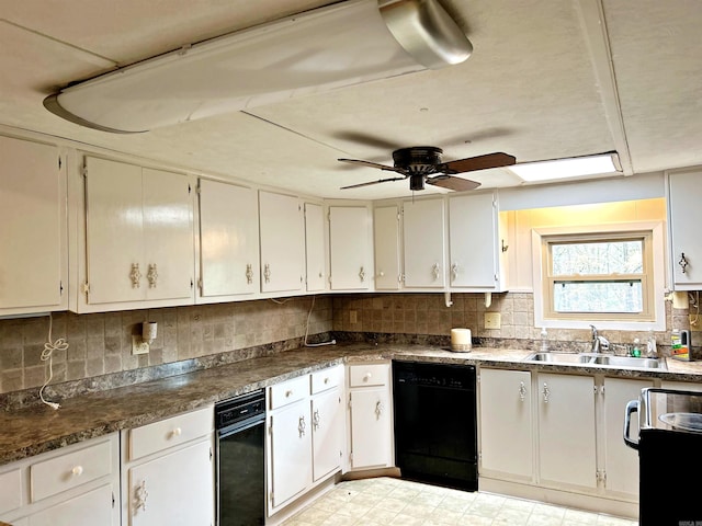 kitchen featuring range, sink, ceiling fan, black dishwasher, and white cabinetry