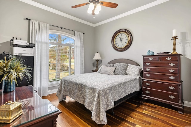 bedroom with ceiling fan, dark hardwood / wood-style flooring, and crown molding