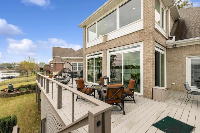 wooden terrace with a water view