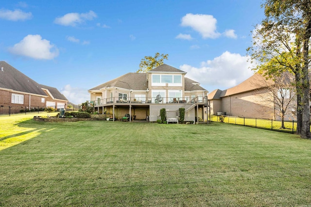 back of house with a yard and a wooden deck