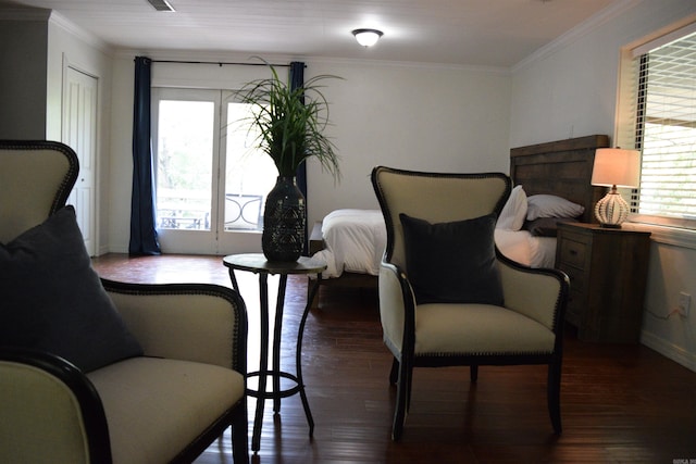 bedroom featuring crown molding and dark hardwood / wood-style flooring