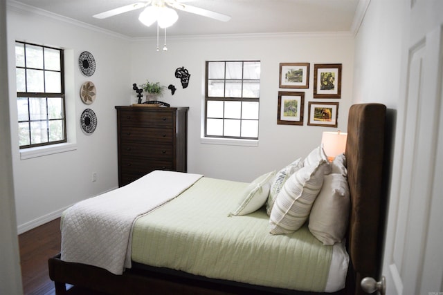 bedroom with hardwood / wood-style floors, ceiling fan, and crown molding