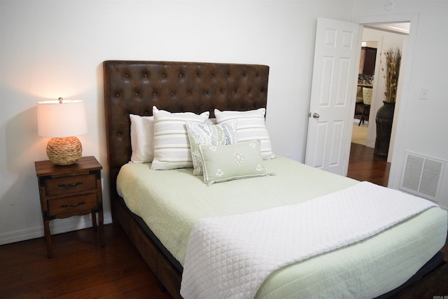 bedroom featuring dark hardwood / wood-style floors