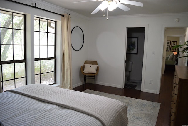 bedroom with ceiling fan, dark hardwood / wood-style floors, ensuite bathroom, and crown molding