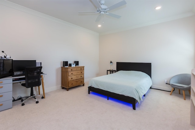 carpeted bedroom with ceiling fan and crown molding