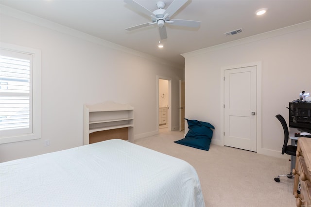 bedroom with ceiling fan, crown molding, ensuite bathroom, and light carpet