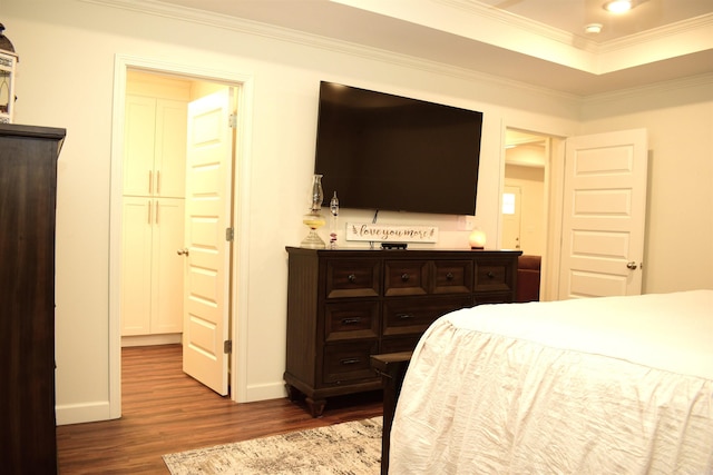 bedroom featuring crown molding and hardwood / wood-style flooring