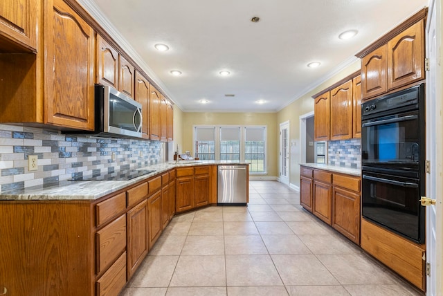 kitchen with black appliances, crown molding, decorative backsplash, light tile patterned floors, and kitchen peninsula