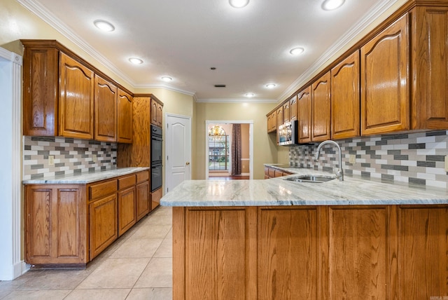 kitchen with light stone countertops, sink, tasteful backsplash, kitchen peninsula, and crown molding